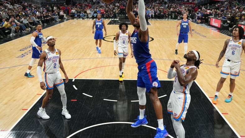 Mar 21, 2023; Los Angeles, California, USA; LA Clippers forward Paul George (13) dunks the ball against the Oklahoma City Thunder in the second half at Crypto.com Arena. Mandatory Credit: Kirby Lee-USA TODAY Sports