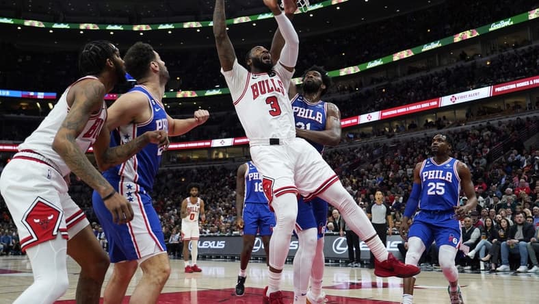 Mar 22, 2023; Chicago, Illinois, USA; Philadelphia 76ers center Joel Embiid (21) defends Chicago Bulls center Andre Drummond (3) during the first quarter at United Center. Mandatory Credit: David Banks-USA TODAY Sports