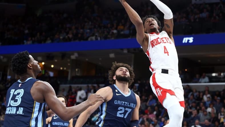Mar 22, 2023; Memphis, Tennessee, USA; Houston Rockets guard Jalen Green (4) drives to the basket during the first half against the Memphis Grizzlies at FedExForum. Mandatory Credit: Petre Thomas-USA TODAY Sports