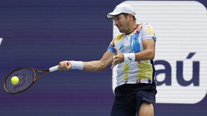 Mar 22, 2023; Miami, Florida, US; Dusan Lajovic (SRB) hits a forehand against Andy Murray (GBR) (not pictured) on day three of the Miami Open at Hard Rock Stadium. Mandatory Credit: Geoff Burke-USA TODAY Sports