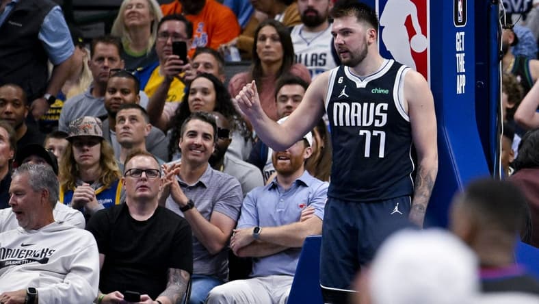 Mar 22, 2023; Dallas, Texas, USA; Dallas Mavericks guard Luka Doncic (77) gestures with his hand to the referees after a foul call during the second half against the Golden State Warriors at the American Airlines Center. Mandatory Credit: Jerome Miron-USA TODAY Sports