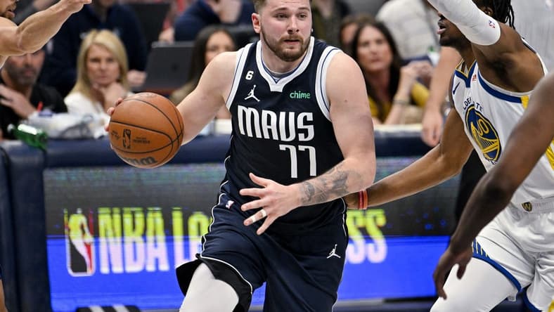 Mar 22, 2023; Dallas, Texas, USA; Dallas Mavericks guard Luka Doncic (77) drives to the basket against the Golden State Warriors during the second half at the American Airlines Center. Mandatory Credit: Jerome Miron-USA TODAY Sports