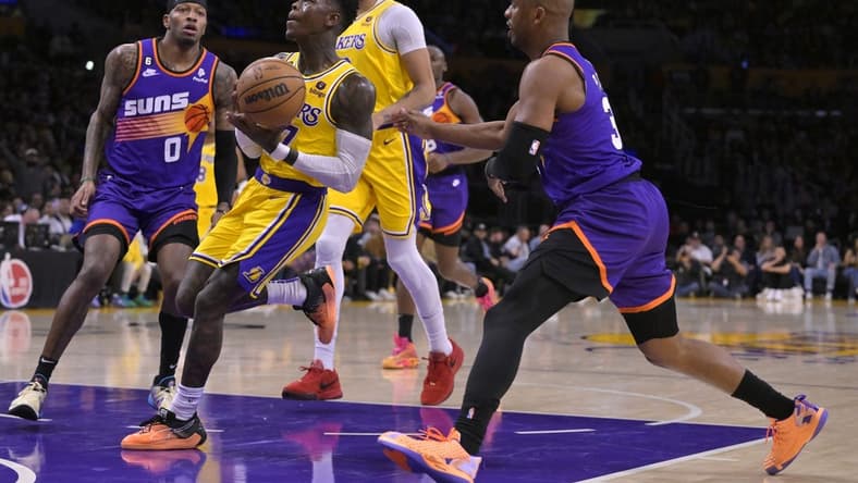 Mar 22, 2023; Los Angeles, California, USA; Los Angeles Lakers guard Dennis Schroder (17) drives past Phoenix Suns guard Chris Paul (3) in the first half at Crypto.com Arena. Mandatory Credit: Jayne Kamin-Oncea-USA TODAY Sports
