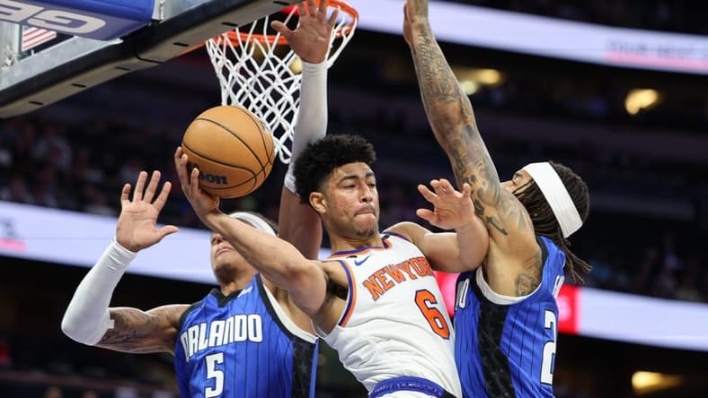 Mar 23, 2023; Orlando, Florida, USA; New York Knicks guard RJ Barrett (9) passes the ball defended by Orlando Magic guard Markelle Fultz (20) in the first quarter at Amway Center. Mandatory Credit: Nathan Ray Seebeck-USA TODAY Sports