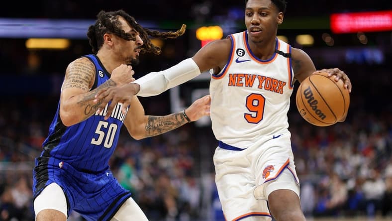 Mar 23, 2023; Orlando, Florida, USA;  New York Knicks guard RJ Barrett (9) controls the ball from Orlando Magic guard Cole Anthony (50) in the second quarter at Amway Center. Mandatory Credit: Nathan Ray Seebeck-USA TODAY Sports