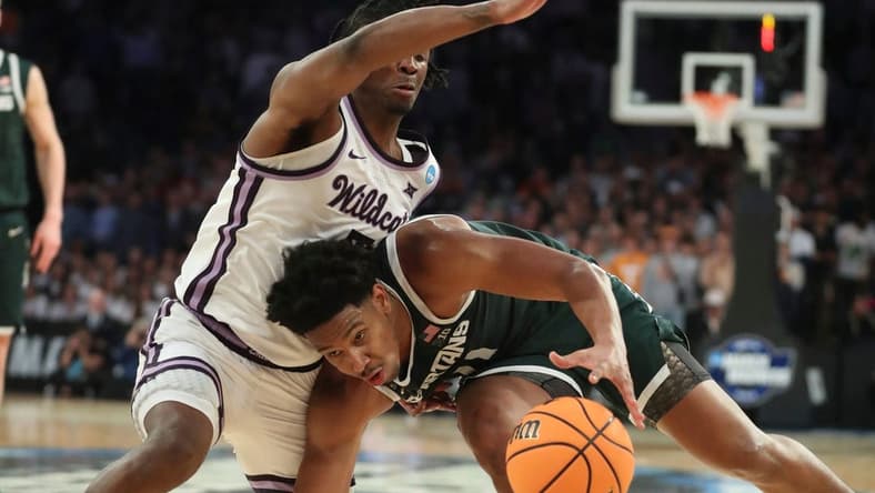 Michigan State guard A.J. Hoggard drives against Kansas State guard Cam Carter during the second half of MSU's 98-93 overtime loss in the Sweet 16 on Thursday, March 23, 2023, in New York.

Msuku 032323 Kd6396