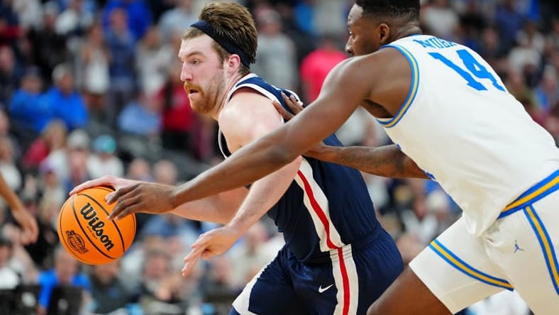 Mar 23, 2023; Las Vegas, NV, USA; Gonzaga Bulldogs forward Drew Timme (2) dribbles the ball against UCLA Bruins forward Kenneth Nwuba (14) during the second half at T-Mobile Arena. Mandatory Credit: Stephen R. Sylvanie-USA TODAY Sports