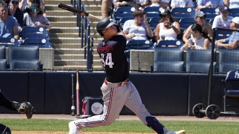 Mar 24, 2023; Tampa, Florida, USA;  Minnesota Twins first baseman Jose Miranda (64) flies out against the New York Yankees during the sixth inning at George M. Steinbrenner Field. Mandatory Credit: Dave Nelson-USA TODAY Sports