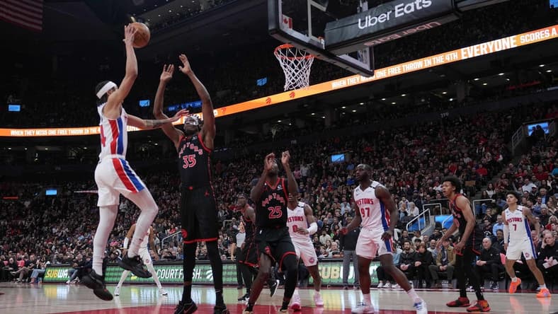 Mar 24, 2023; Toronto, Ontario, CAN; Detroit Pistons guard R.J. Hampton (14) drives to the basket as Toronto Raptors center Christian Koloko (35) tries to defend during the second quarter at Scotiabank Arena. Mandatory Credit: Nick Turchiaro-USA TODAY Sports