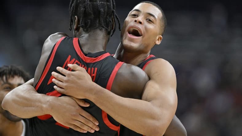 Mar 24, 2023; Louisville, KY, USA; San Diego State Aztecs forward Jaedon LeDee (13) hugs San Diego State Aztecs forward Nathan Mensah (31) during the second half of the NCAA tournament round of sixteen against the Alabama Crimson Tide at KFC YUM! Center. Mandatory Credit: Jamie Rhodes-USA TODAY Sports