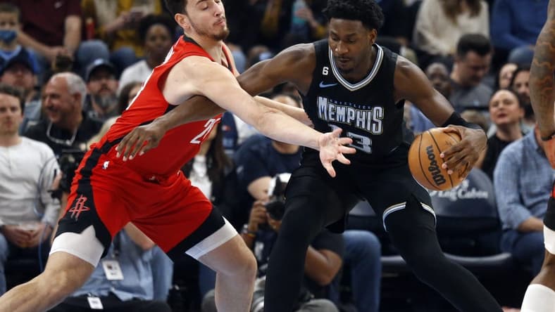 Mar 24, 2023; Memphis, Tennessee, USA; Memphis Grizzlies forward Jaren Jackson Jr. (13) drives to the basket as Houston Rockets center Alperen Sengun (28) defends during the first half at FedExForum. Mandatory Credit: Petre Thomas-USA TODAY Sports