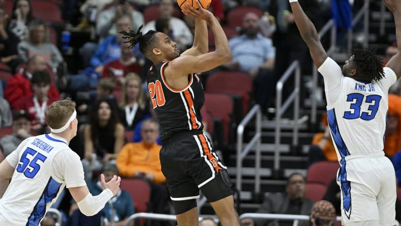 Mar 24, 2023; Louisville, KY, USA; Princeton Tigers forward Tosan Evbuomwan (20) shoots over Creighton Bluejays center Fredrick King (33) during the first half of the NCAA tournament round of sixteen at KFC YUM! Center. Mandatory Credit: Jamie Rhodes-USA TODAY Sports