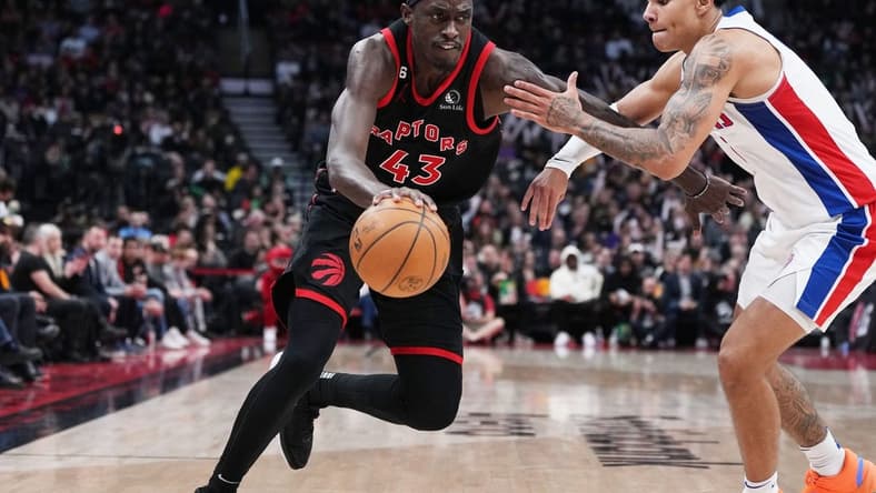 Mar 24, 2023; Toronto, Ontario, CAN; Toronto Raptors forward Pascal Siakam (43) controls the ball as Detroit Pistons guard Killian Hayes (7) tries to defend during the third quarter at Scotiabank Arena. Mandatory Credit: Nick Turchiaro-USA TODAY Sports