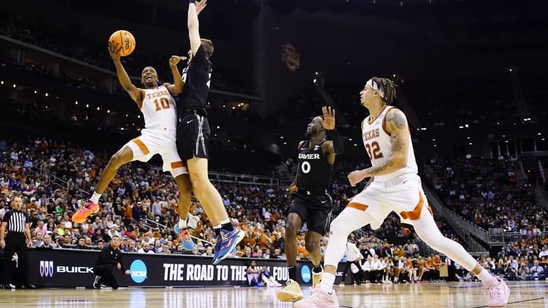 Mar 24, 2023; Kansas City, MO, USA; Texas Longhorns guard Sir'Jabari Rice (10) attempts a shot against Xavier Musketeers forward Jack Nunge (24) during the first half of an NCAA tournament Midwest Regional semifinal at T-Mobile Center. Mandatory Credit: Jay Biggerstaff-USA TODAY Sports