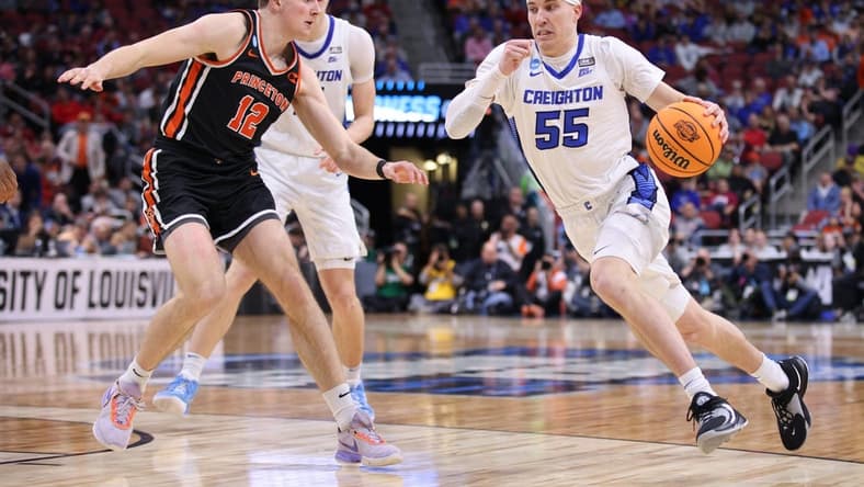 Mar 24, 2023; Louisville, KY, USA; Creighton Bluejays guard Baylor Scheierman (55) drives against Princeton Tigers forward Caden Pierce (12) during the second half of the NCAA tournament round of sixteen at KFC YUM! Center. Mandatory Credit: Jordan Prather-USA TODAY Sports