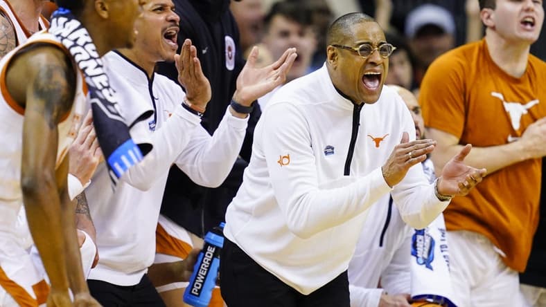 Mar 24, 2023; Kansas City, MO, USA; Texas Longhorns head coach Rodney Terry cheers from the bench during the first half of an NCAA tournament Midwest Regional semifinal against the Xavier Musketeers at T-Mobile Center. Mandatory Credit: Jay Biggerstaff-USA TODAY Sports