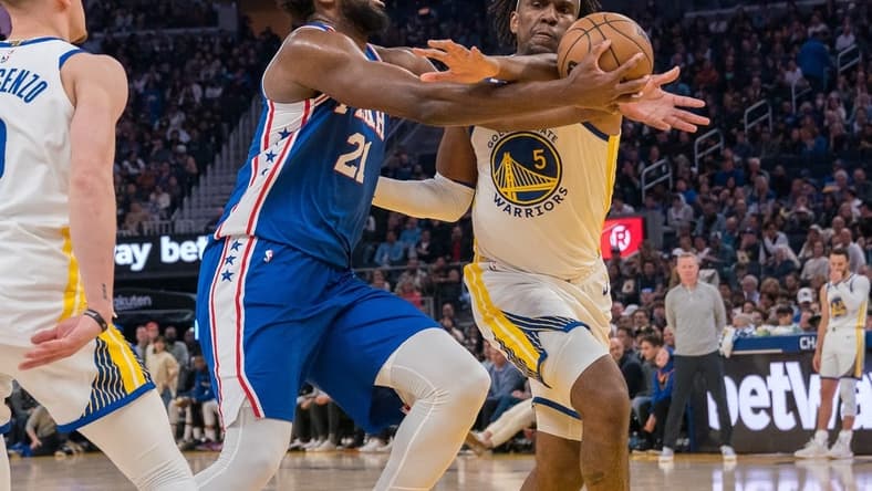 Mar 24, 2023; San Francisco, California, USA;  Philadelphia 76ers center Joel Embiid (21) is fouled in the act of shooting by Golden State Warriors forward Kevon Looney (5) during the second quarter at Chase Center. Mandatory Credit: Neville E. Guard-USA TODAY Sports