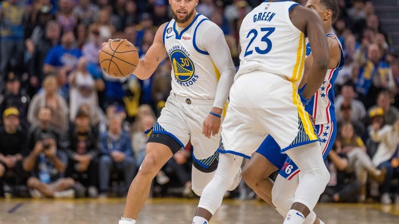 Mar 24, 2023; San Francisco, California, USA;  Golden State Warriors guard Stephen Curry (30) dribbles the basketball against the Philadelphia 76ers in the fourth quarter at Chase Center. Mandatory Credit: Neville E. Guard-USA TODAY Sports