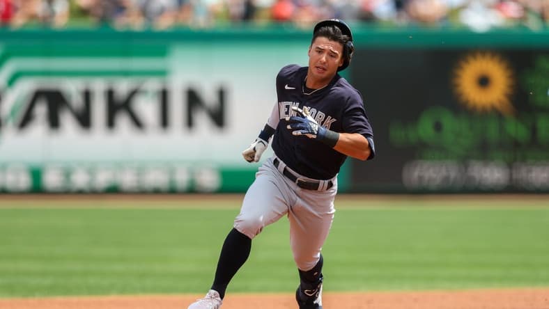 Mar 25, 2023; Clearwater, Florida, USA; New York Yankees shortstop Anthony Volpe (77) triples against the Philadelphia Phillies in the first inning during spring training at BayCare Ballpark. Mandatory Credit: Nathan Ray Seebeck-USA TODAY Sports