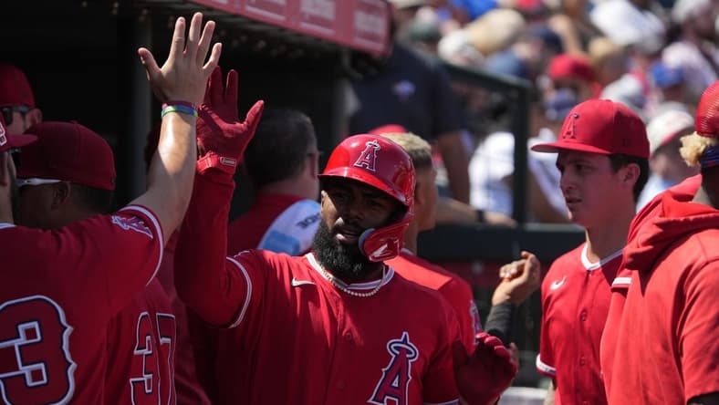 Mar 25, 2023; Tempe, Arizona, USA; Los Angeles Angels second baseman Luis Rengifo (2) celebrates with teammates after scoring against the Chicago Cubs in the third inning at Tempe Diablo Stadium. Mandatory Credit: Rick Scuteri-USA TODAY Sports