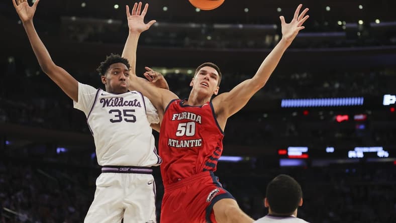 Mar 25, 2023; New York, NY, USA; Kansas State Wildcats forward Nae'Qwan Tomlin (35) and Florida Atlantic Owls center Vladislav Goldin (50) fight for the ball during the second half of an NCAA tournament East Regional final at Madison Square Garden. Mandatory Credit: Brad Penner-USA TODAY Sports