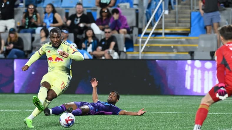Mar 25, 2023; Charlotte, North Carolina, USA; New York Red Bulls attacker Elias Manoel (11) shoots goal in the first half against Charlotte FC at Bank of America Stadium. Mandatory Credit: Griffin Zetterberg-USA TODAY Sports