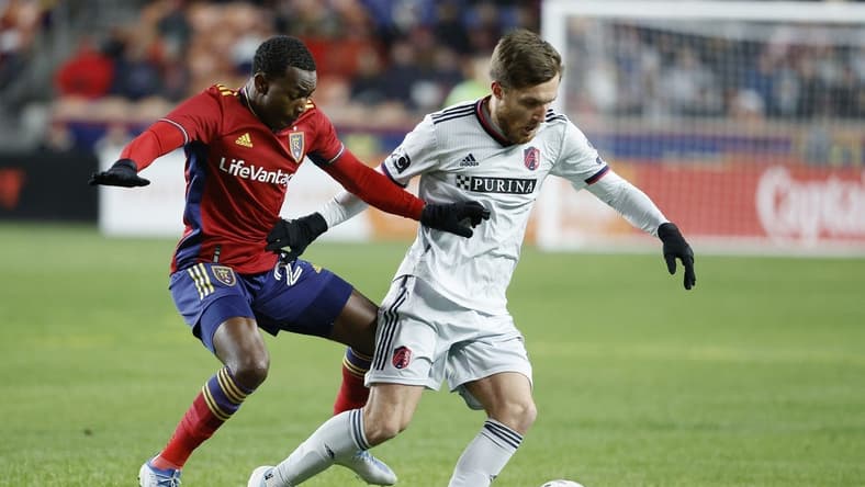 Mar 25, 2023; Sandy, Utah, USA;  Real Salt Lake midfielder Anderson Julio (29) and St. Louis City midfielder Indiana Vassilev (19) battle in the first half at America First Field. Mandatory Credit: Jeffrey Swinger-USA TODAY Sports
