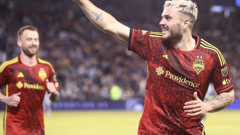 Mar 25, 2023; Kansas City, Kansas, USA; Seattle Sounders forward Jordan Morris (13) celebrates after scoring a goal during the second half against the Sporting Kansas City at Children's Mercy Park. Mandatory Credit: William Purnell-USA TODAY Sports