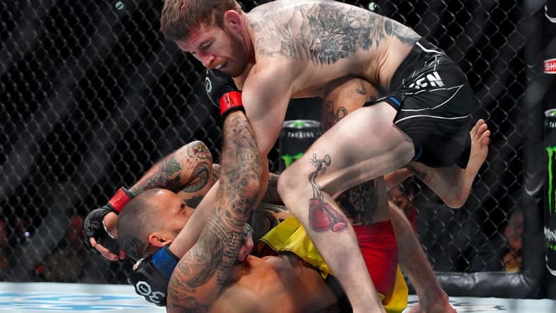 Mar 25, 2023; San Antonio, Texas, USA; Marlon Vera (red gloves) fights Cory Sandhagen (blue gloves) during UFC Fight Night at AT&T Center. Mandatory Credit: Aaron Meullion-USA TODAY Sports