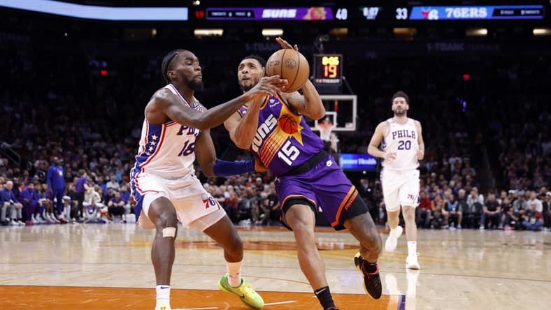 Mar 25, 2023; Phoenix, Arizona, USA; Phoenix Suns guard Cameron Payne (15) drives to the basket against Philadelphia 76ers guard Shake Milton (18) during the first half at Footprint Center. Mandatory Credit: Chris Coduto-USA TODAY Sports