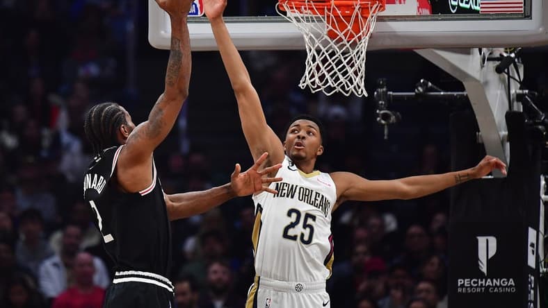 Mar 25, 2023; Los Angeles, California, USA; Los Angeles Clippers forward Kawhi Leonard (2) shoots against New Orleans Pelicans guard Trey Murphy III (25) during the first half at Crypto.com Arena. Mandatory Credit: Gary A. Vasquez-USA TODAY Sports