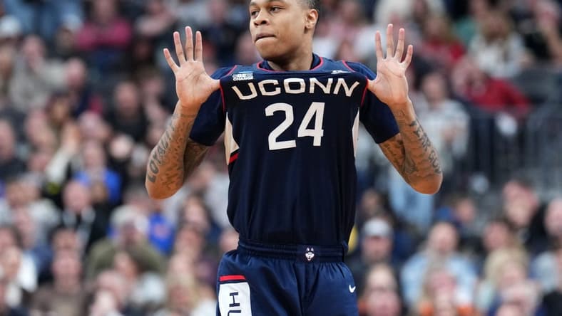 Mar 25, 2023; Las Vegas, NV, USA; Connecticut Huskies guard Jordan Hawkins (24) reacts against the Gonzaga Bulldogs during the second half for the NCAA tournament West Regional final at T-Mobile Arena. Mandatory Credit: Joe Camporeale-USA TODAY Sports