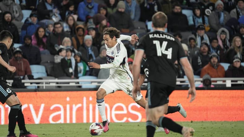 Mar 25, 2023; Saint Paul, Minnesota, USA; Vancouver Whitecaps FC forward Simon Becher (29) in action against Minnesota United FC defenders during the second half at Allianz Field. Mandatory Credit: Matt Blewett-USA TODAY Sports