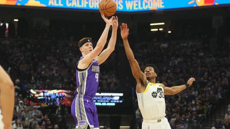 Mar 25, 2023; Sacramento, California, USA; Sacramento Kings guard Kevin Huerter (9) shoots against Utah Jazz guard Ochai Agbaji (30) during the first quarter at Golden 1 Center. Mandatory Credit: Darren Yamashita-USA TODAY Sports