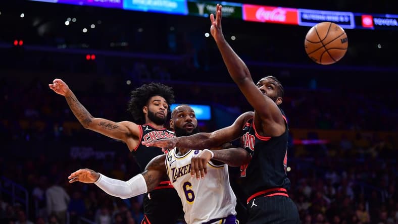 Mar 26, 2023; Los Angeles, California, USA; Los Angeles Lakers forward LeBron James (6) plays for the rebound against Chicago Bulls guard Coby White (0) and forward Patrick Williams (44) during the first half at Crypto.com Arena. Mandatory Credit: Gary A. Vasquez-USA TODAY Sports