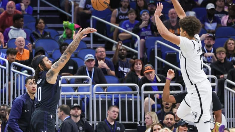 Mar 26, 2023; Orlando, Florida, USA; Orlando Magic guard Markelle Fultz (20) shoots the ball against Brooklyn Nets forward Cameron Johnson (2) during the first quarter at Amway Center. Mandatory Credit: Mike Watters-USA TODAY Sports