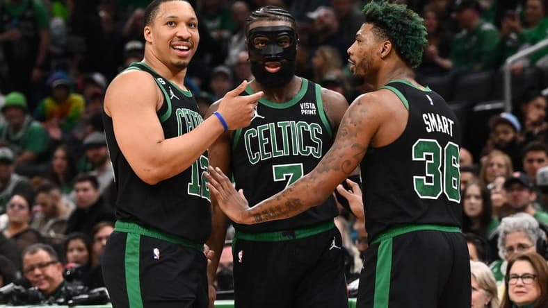 Mar 26, 2023; Boston, Massachusetts, USA; Boston Celtics forward Grant Williams (12), guard Jaylen Brown (7), and guard Marcus Smart (36) talk during a timeout during a game against the San Antonio Spurs at the TD Garden. Mandatory Credit: Brian Fluharty-USA TODAY Sports