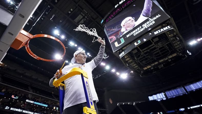 Mar 26, 2023; Kansas City, MO, USA; Miami Hurricanes head coach Jim Larranaga cuts down the net after defeating the Texas Longhorns at the T-Mobile Center. Mandatory Credit: Jay Biggerstaff-USA TODAY Sports