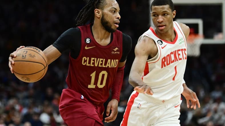 Mar 26, 2023; Cleveland, Ohio, USA; Cleveland Cavaliers guard Darius Garland (10) drives to the basket against Houston Rockets forward Jabari Smith Jr. (1) during the second half at Rocket Mortgage FieldHouse. Mandatory Credit: Ken Blaze-USA TODAY Sports