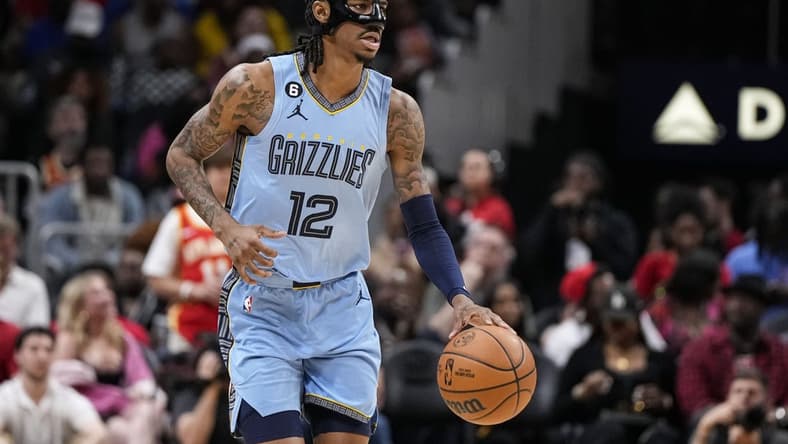 Mar 26, 2023; Atlanta, Georgia, USA; Memphis Grizzlies guard Ja Morant (12) dribbles against the Atlanta Hawks during the second half at State Farm Arena. Mandatory Credit: Dale Zanine-USA TODAY Sports