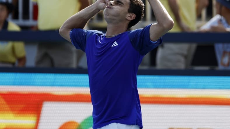 Mar 27, 2023; Miami, Florida, US; Francisco Cerundolo (ARG) celebrates after his match against Felix Auger-Aliassime (CAN) on day eight of the Miami Open at Hard Rock Stadium. Mandatory Credit: Geoff Burke-USA TODAY Sports