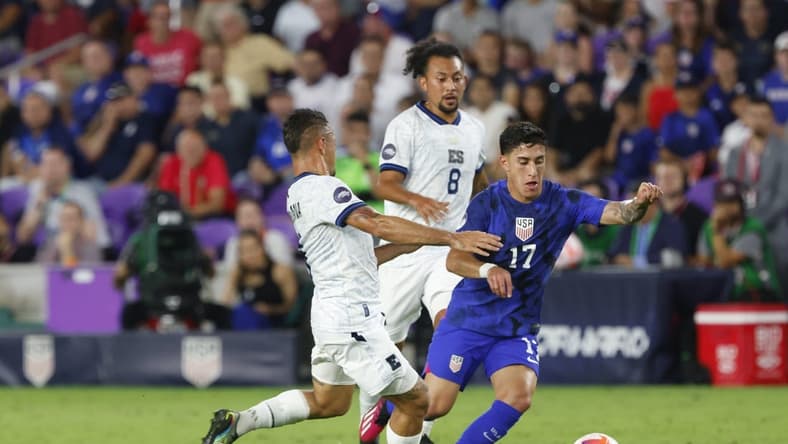 Mar 27, 2023; Orlando, Florida, USA; El Salvador midfielder Narciso Orellana (6) and El Salvador midfielder Bryan Landaverde (8) battle United States of America forward Alex Zendejas (17) for the ball during the first half at Exploria Stadium. Mandatory Credit: Reinhold Matay-USA TODAY Sports