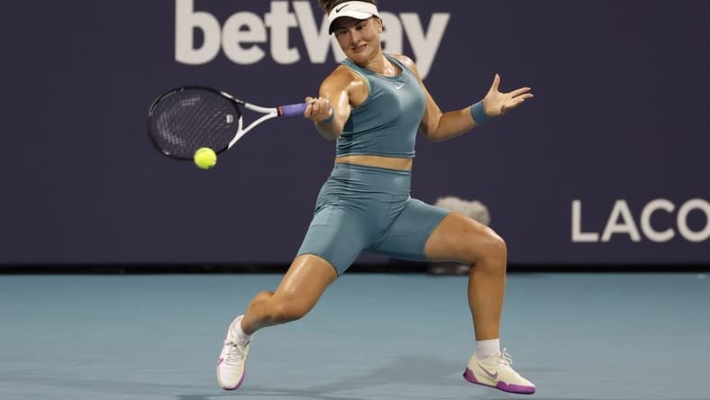 Mar 27, 2023; Miami, Florida, US; Bianca Andreescu (CAN) hits a forehand against Ekaterina Alexandrova (not pictured) on day eight of the Miami Open at Hard Rock Stadium. Mandatory Credit: Geoff Burke-USA TODAY Sports