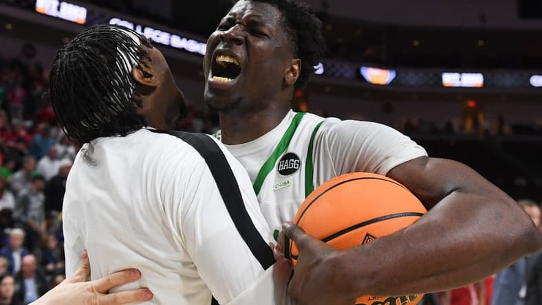 Mar 28, 2023; Las Vegas, NV, USA; North Texas Mean Green forward Moulaye Sissoko (14) celebrates the victory against the Wisconsin Badgers at Orleans Arena. Mandatory Credit: Candice Ward-USA TODAY Sports