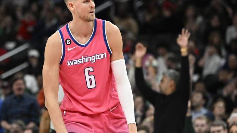 Mar 28, 2023; Washington, District of Columbia, USA; Washington Wizards center Kristaps Porzingis (6) reacts after a basket against the Boston Celtics during the second half at Capital One Arena. Mandatory Credit: Brad Mills-USA TODAY Sports