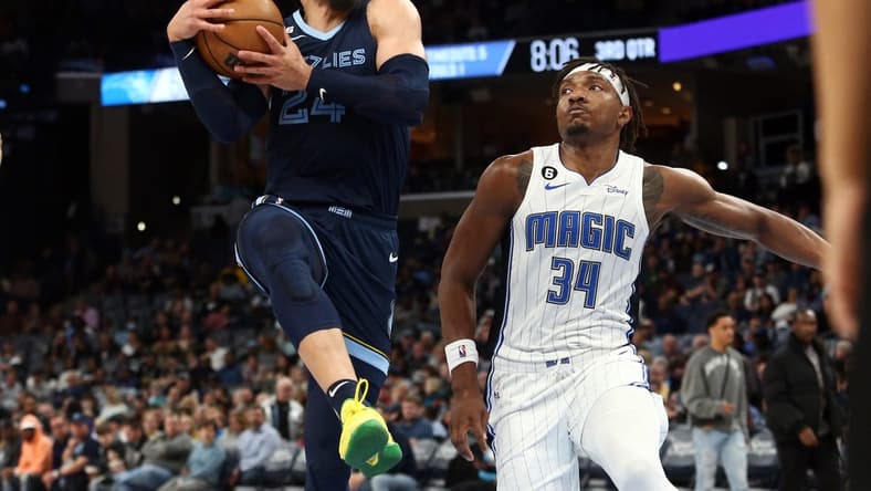 Mar 28, 2023; Memphis, Tennessee, USA; Memphis Grizzlies forward Dillon Brooks (24) drives to the basket as Orlando Magic center Wendell Carter Jr. (34) defends during the second half at FedExForum. Mandatory Credit: Petre Thomas-USA TODAY Sports