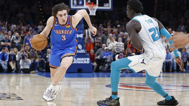 Mar 28, 2023; Oklahoma City, Oklahoma, USA; Oklahoma City Thunder guard Josh Giddey (3) drives to the basket against Charlotte Hornets forward JT Thor (21) during the second half at Paycom Center. Charlotte won 137-134. Mandatory Credit: Alonzo Adams-USA TODAY Sports