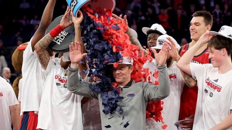 Mar 25, 2023; New York, NY, USA; Florida Atlantic Owls head coach Dusty May celebrates with his team after defeating the Kansas State Wildcats at Madison Square Garden to advance to the final four. Mandatory Credit: Brad Penner-USA TODAY Sports