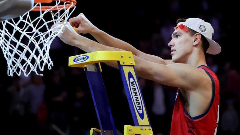 Mar 25, 2023; New York, NY, USA; Florida Atlantic Owls center Vladislav Goldin (50) cuts a piece of the net after defeating the Kansas State Wildcats at Madison Square Garden to advance to the final four. Mandatory Credit: Brad Penner-USA TODAY Sports