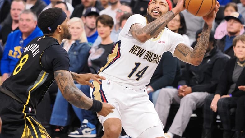 Mar 28, 2023; San Francisco, California, USA; New Orleans Pelicans small forward Brandon Ingram (14) looks to the basket against Golden State Warriors guard Gary Payton II (8) during the third quarter at Chase Center. Mandatory Credit: Kelley L Cox-USA TODAY Sports